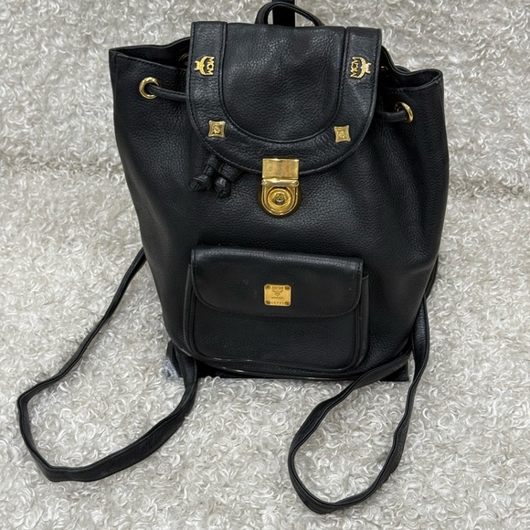 MCM Handbags - MCM Black Leather Backpack with Gold Accents